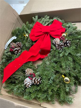 24 inch diameter fresh live balsam holiday wreath decorated with red velvet bow